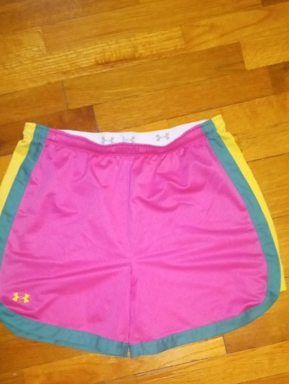 women med Under Armour pink mesh shorts